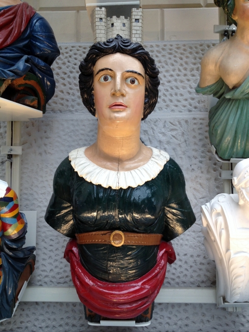 The figurehead for HSM London (1840-84) has a model of the Tower of London on her head.